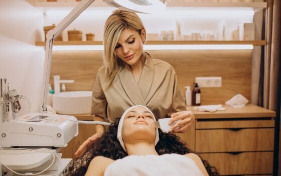 woman cosmetologist making beauty procedures
