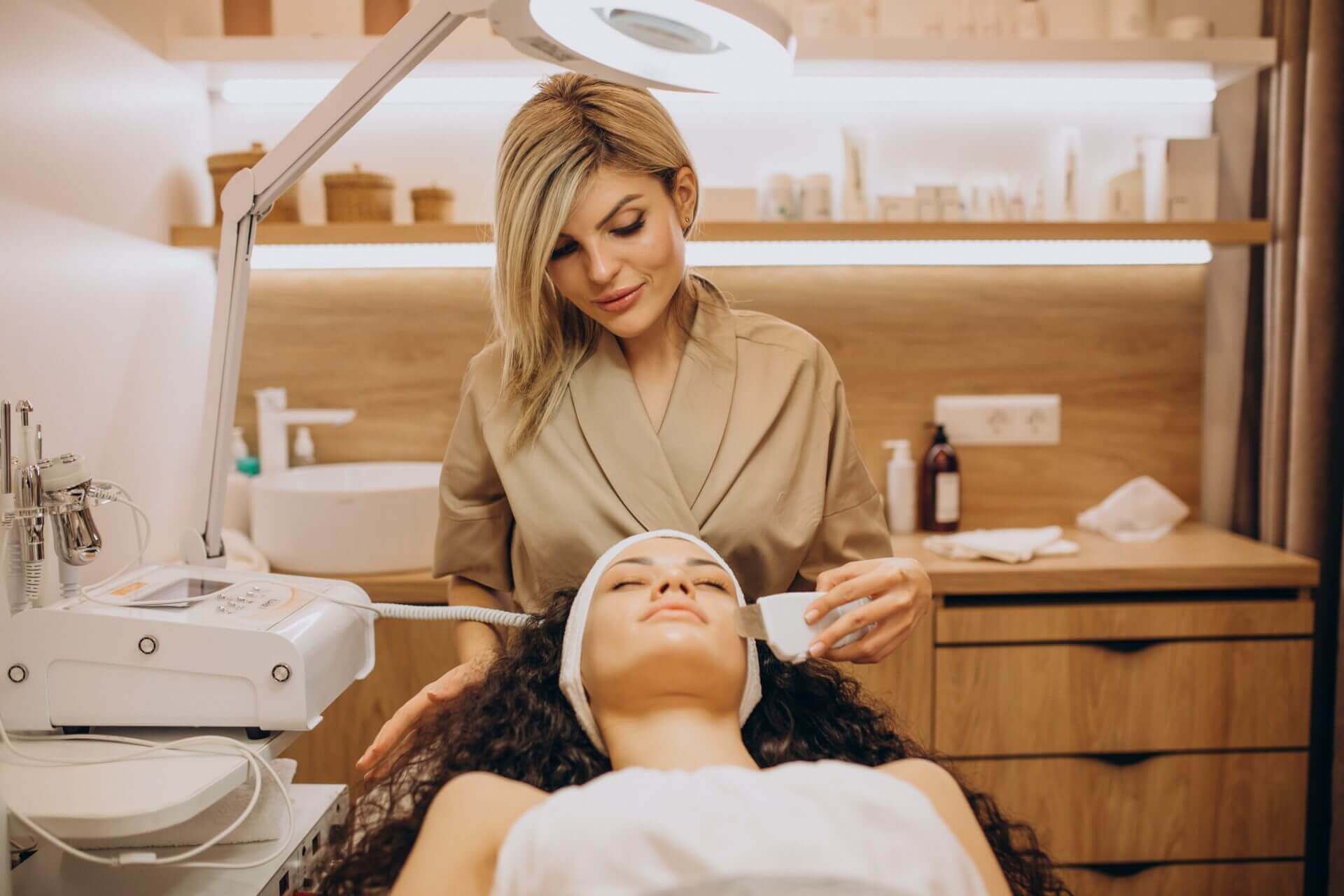 woman cosmetologist making beauty procedures