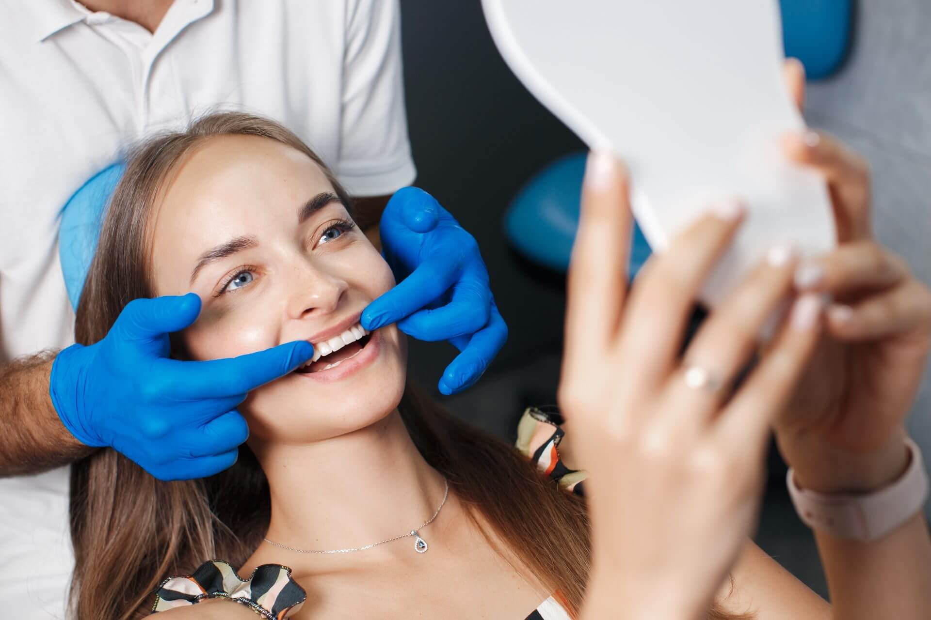 dentist examining womans teeth