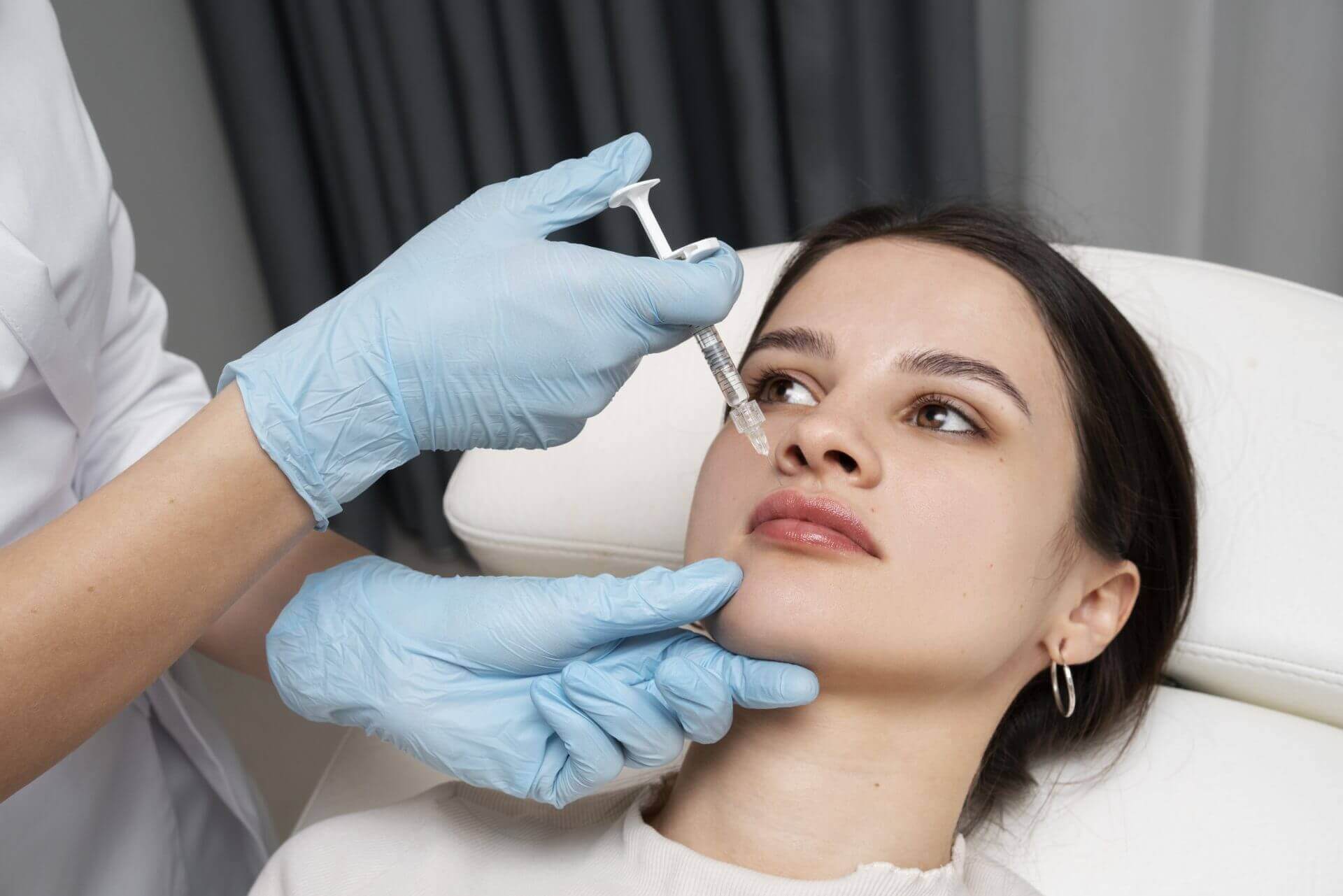 woman having dermal filler injected