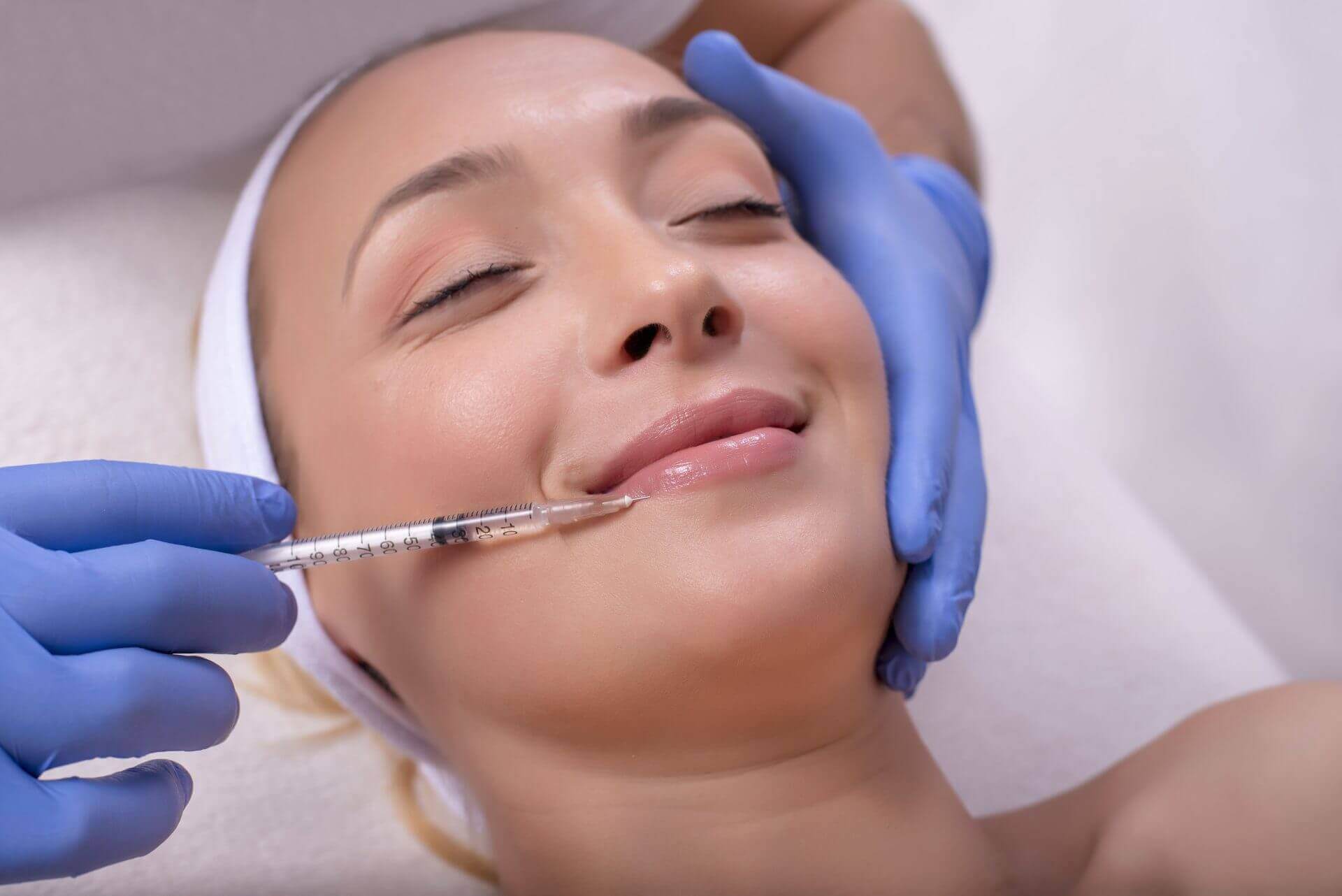 women having lip fillers injected